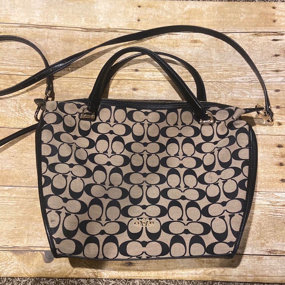 Tan coach brand purse gently used with a few marks as seen in the pictures
